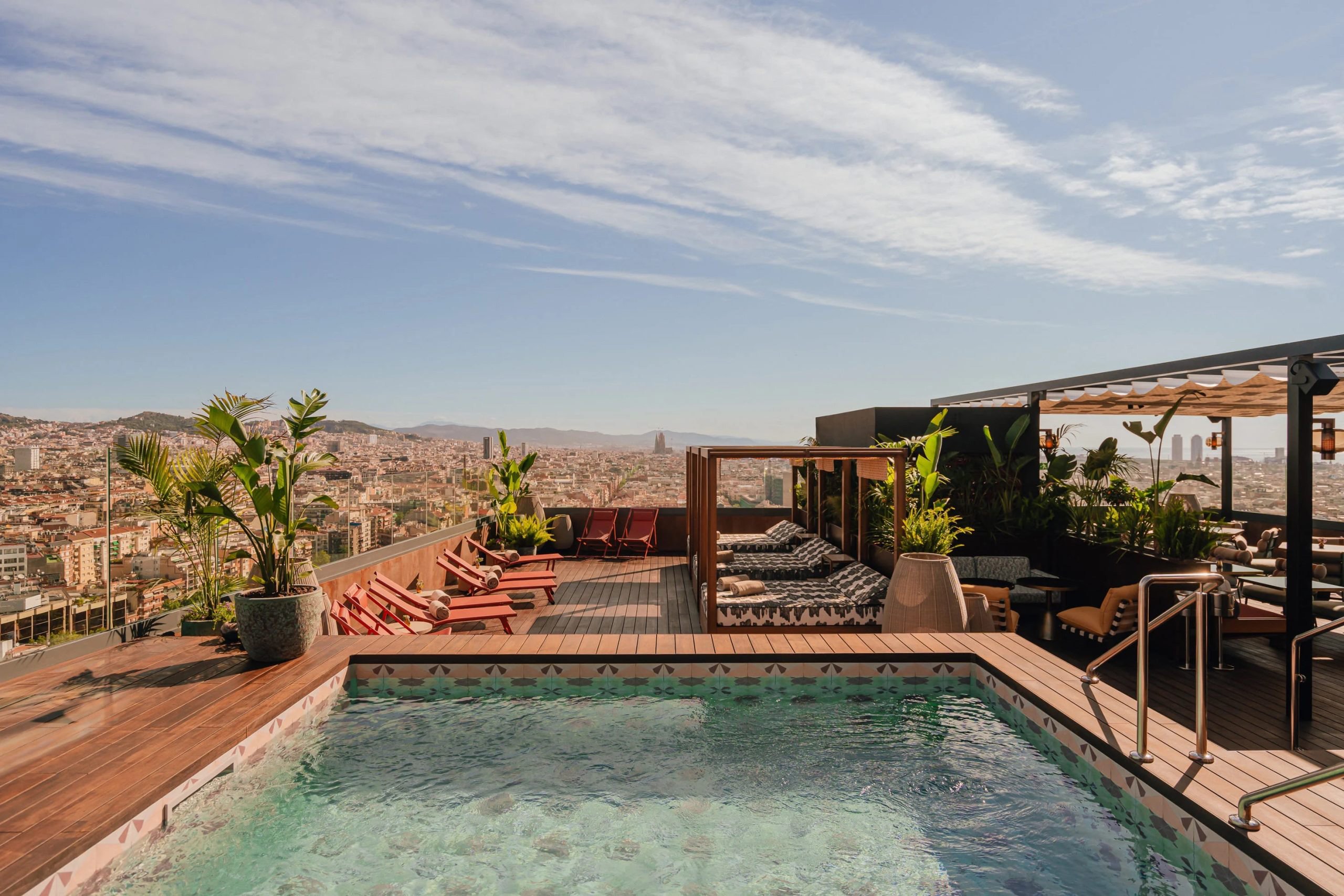 An elegant rooftop pool offering a panoramic view of the city