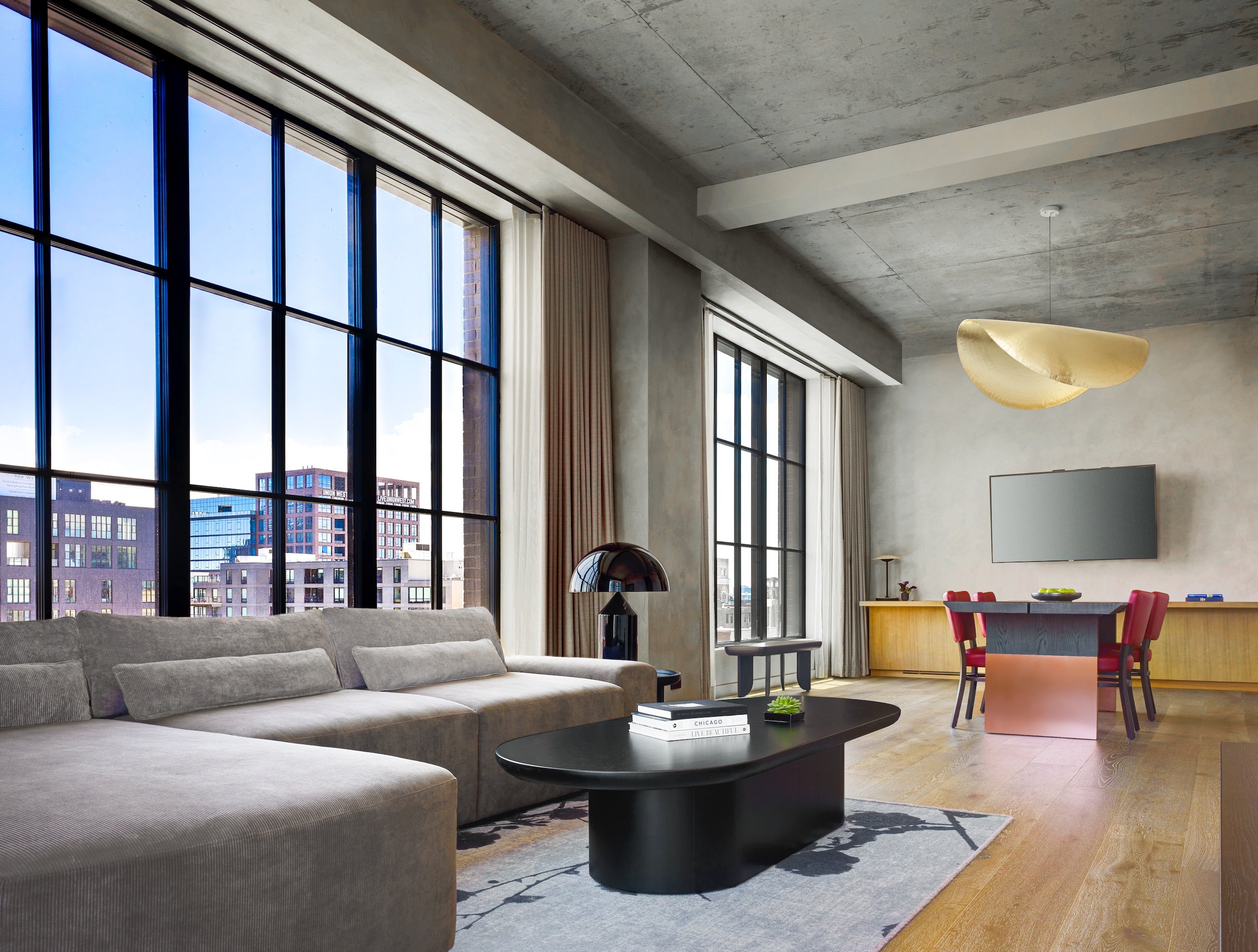 living room with grey sectional and black table