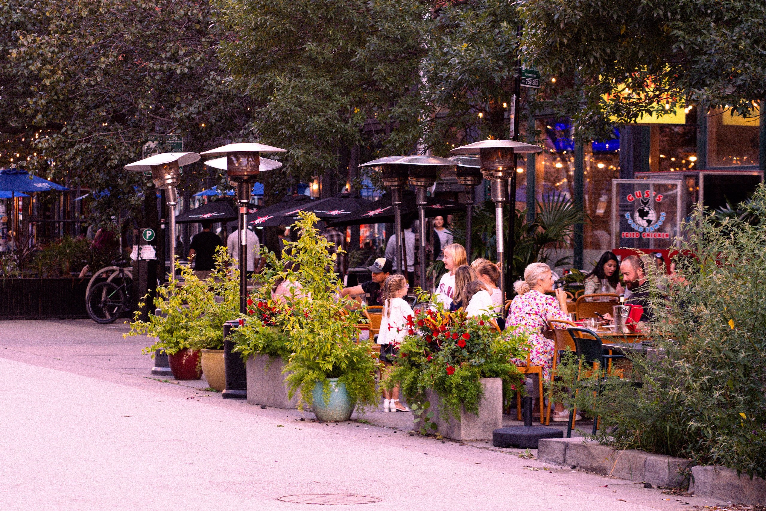 people on the patio of a restaurant eating