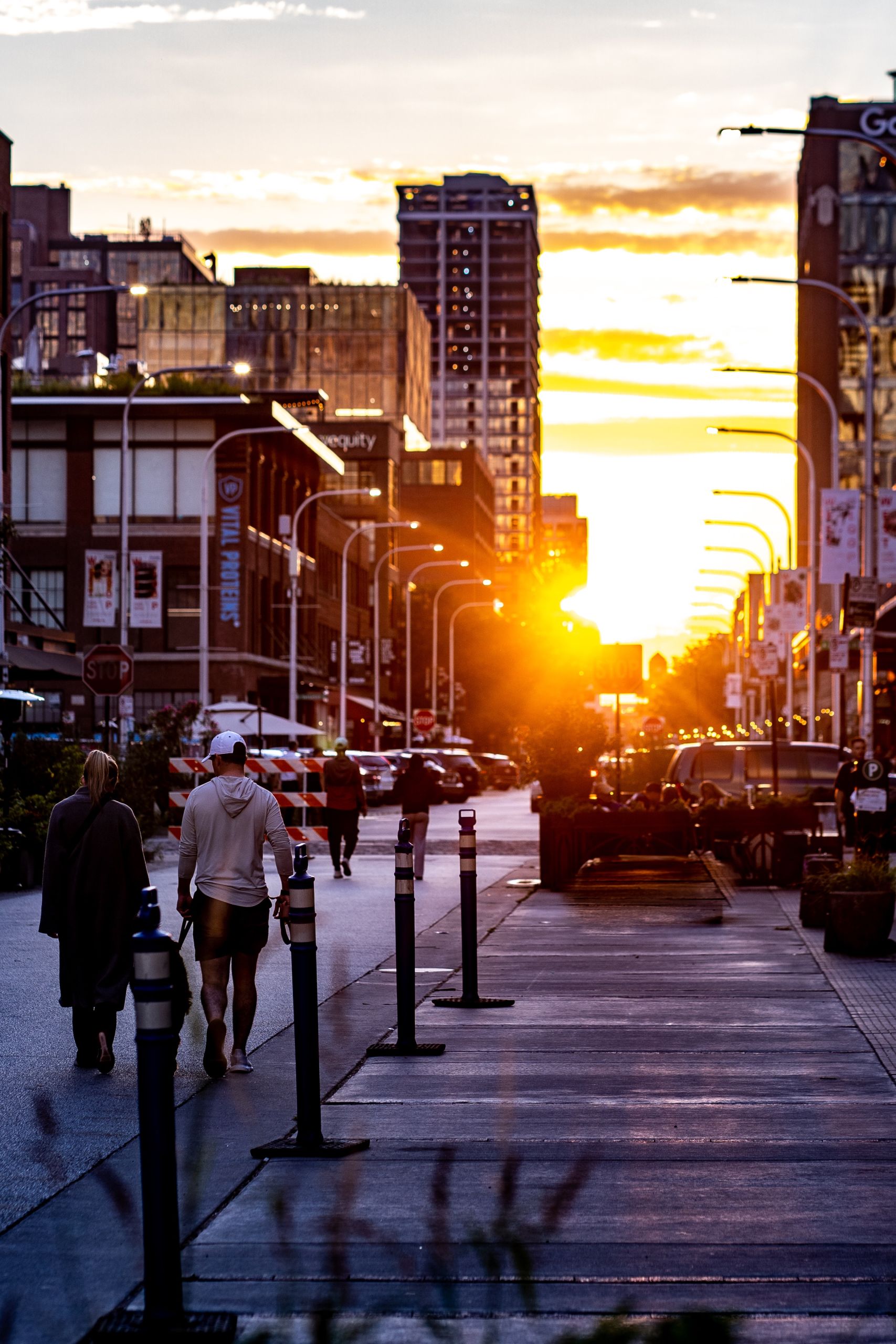 couple walking their dog at sunset down the streets of Chicago