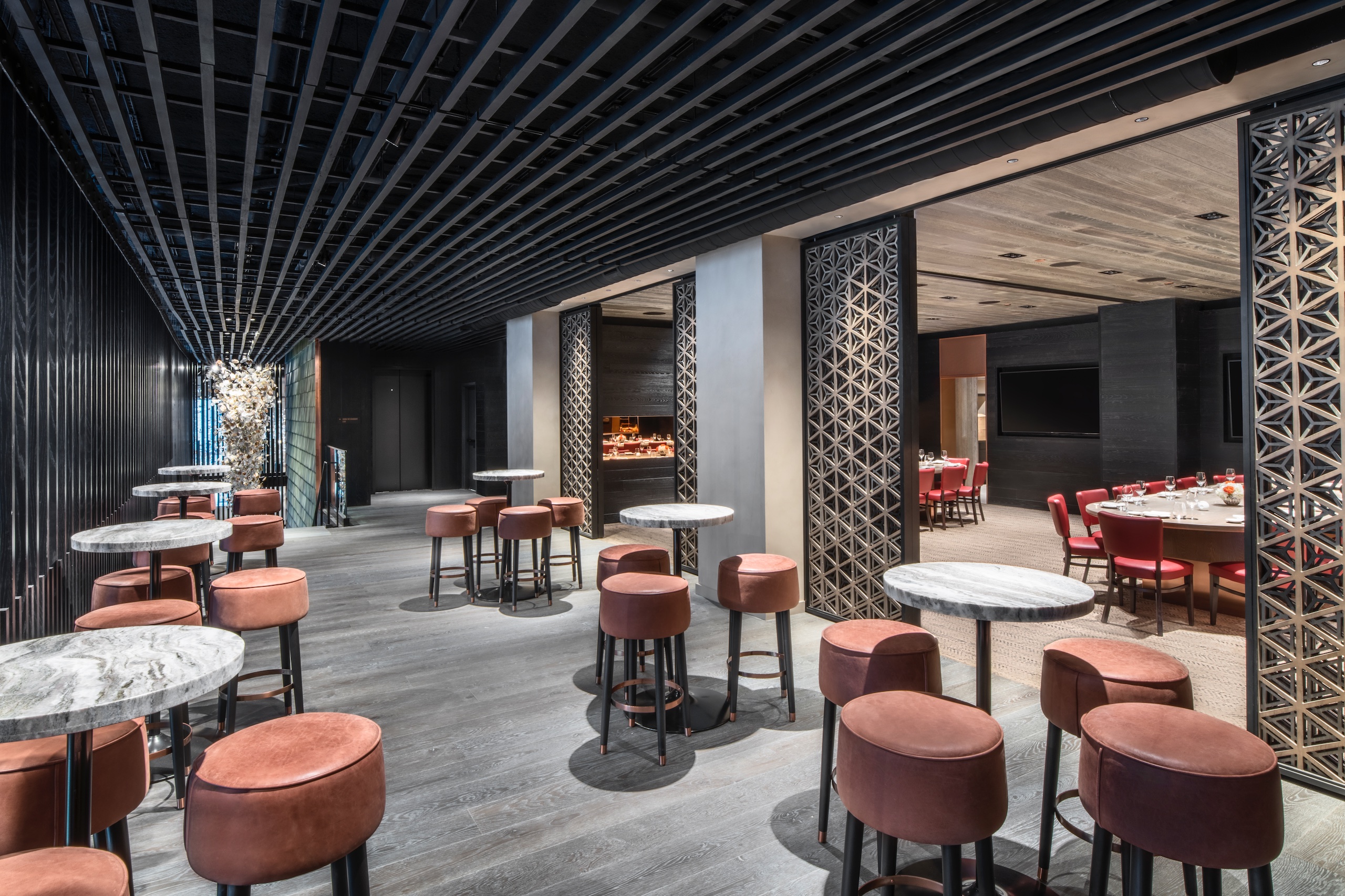 dining area with view of sectioned off dining area with large oval table and red chairs