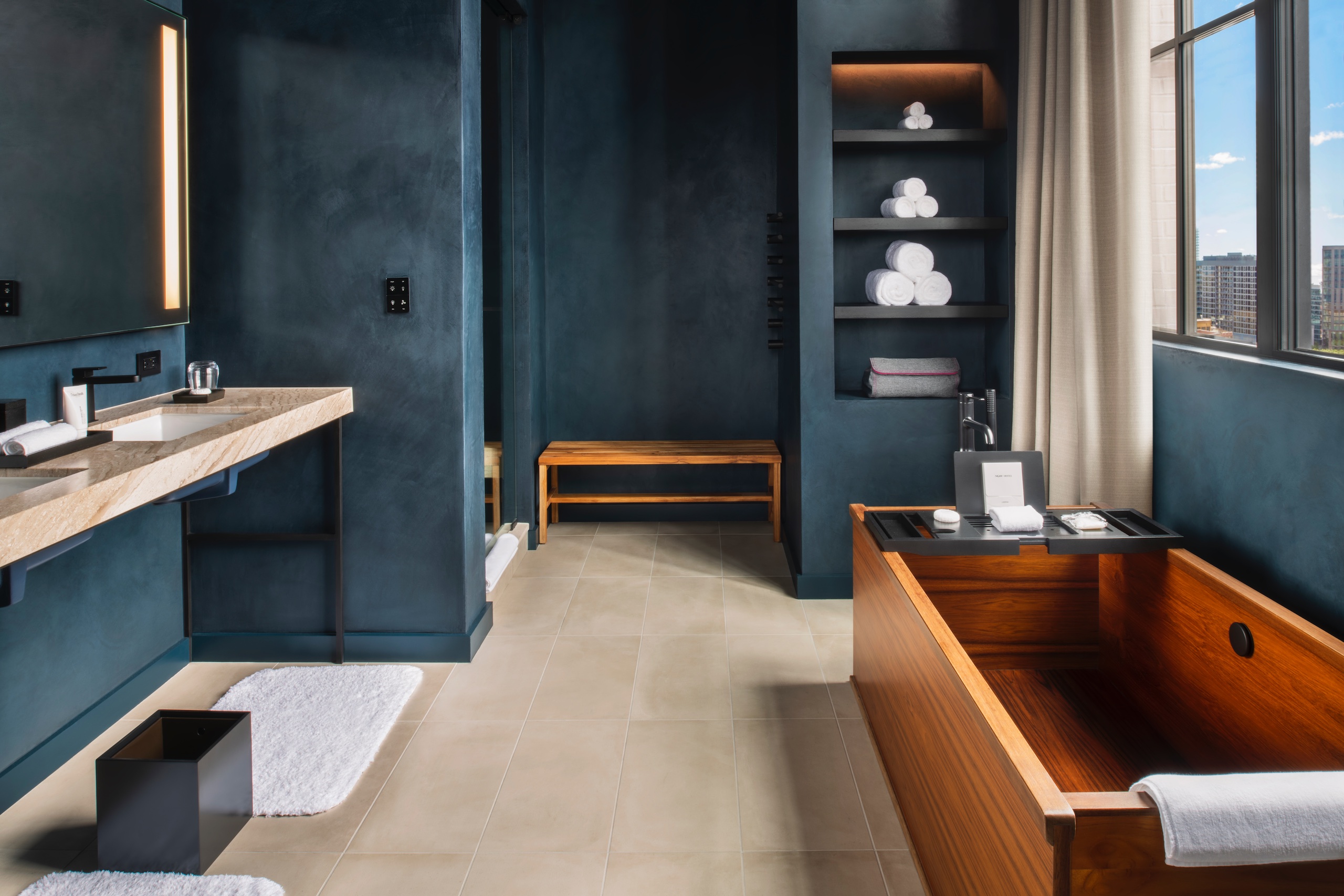 dark painted bathroom walls with wooden tub