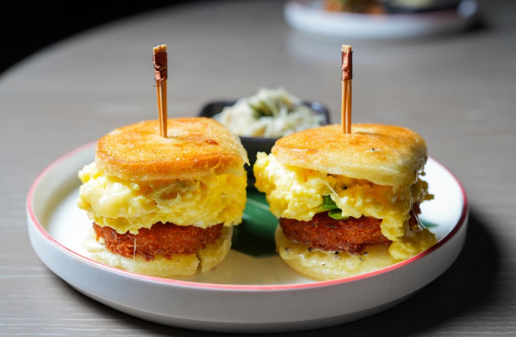 Two cute mini sandwiches on a plate, looking appetizing and perfect for a quick snack or party platter.