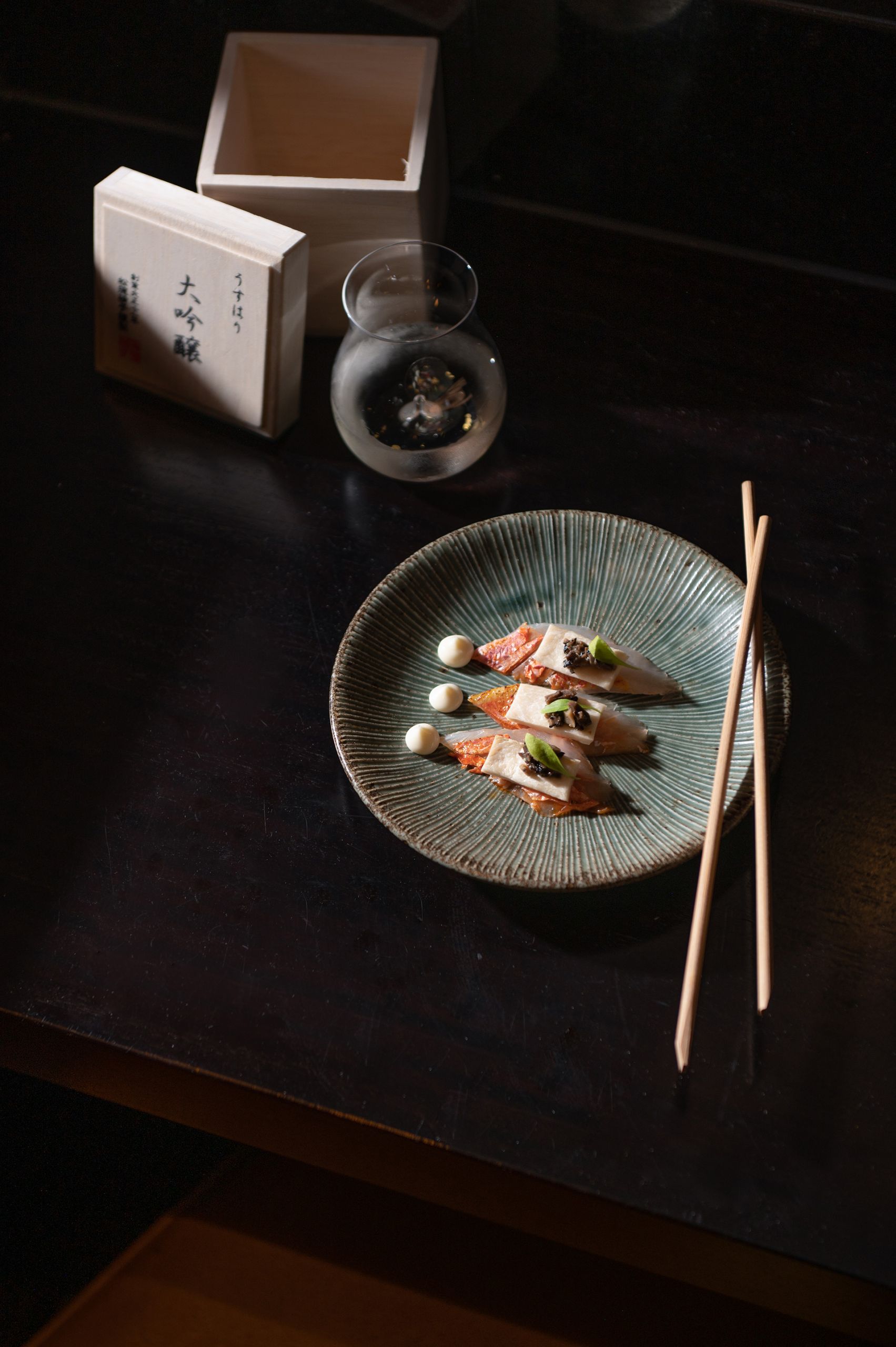 Sake and sushi on table - Seasonal Omakase