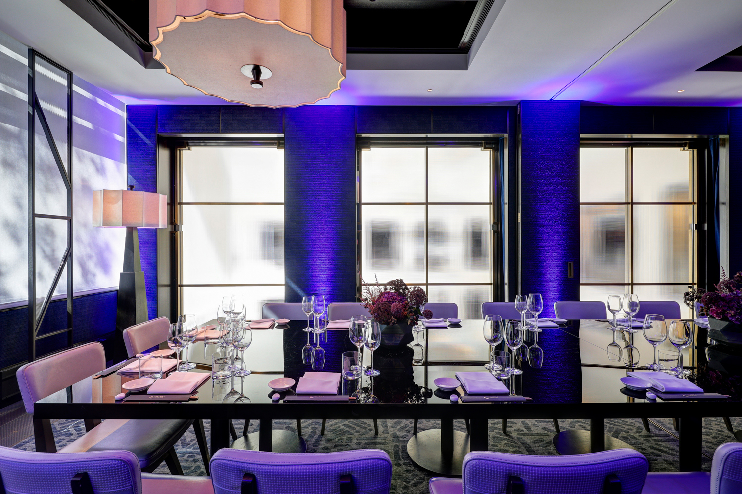 Private dining set up in violet lighting