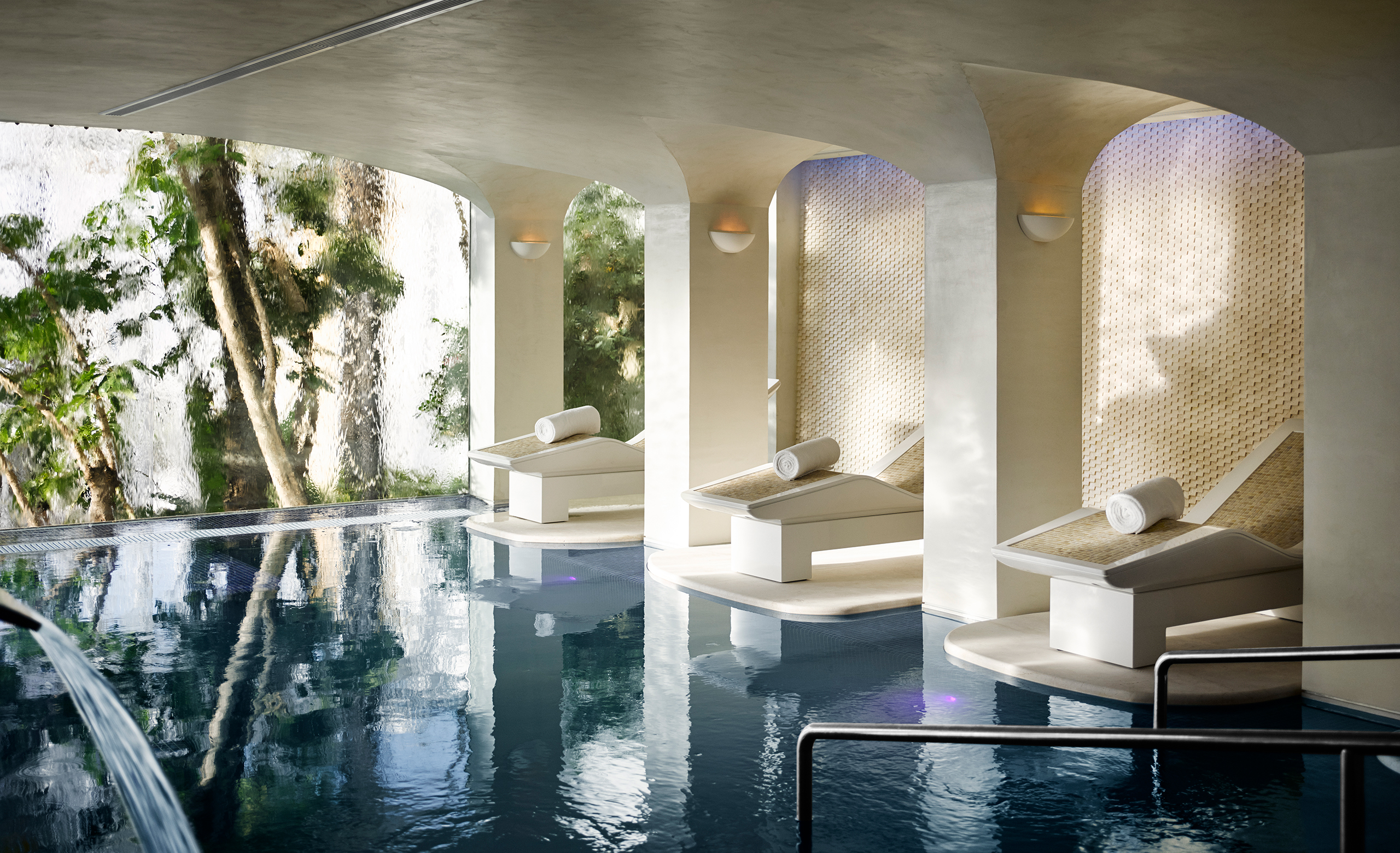 luxurious indoor vitality pool offering a peaceful retreat with elegant decor and relaxing treatment rooms