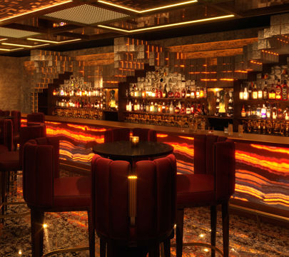 A stylish bar scene showcasing bright red chairs around a polished bar counter, perfect for socializing and unwinding