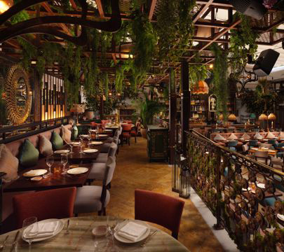 A beautifully decorated restaurant filled with various plants, offering a serene and welcoming environment for guests