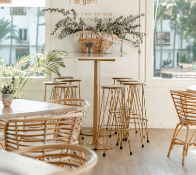 Inviting restaurant space showcasing wooden tables and chairs, designed for comfort and a welcoming dining vibe