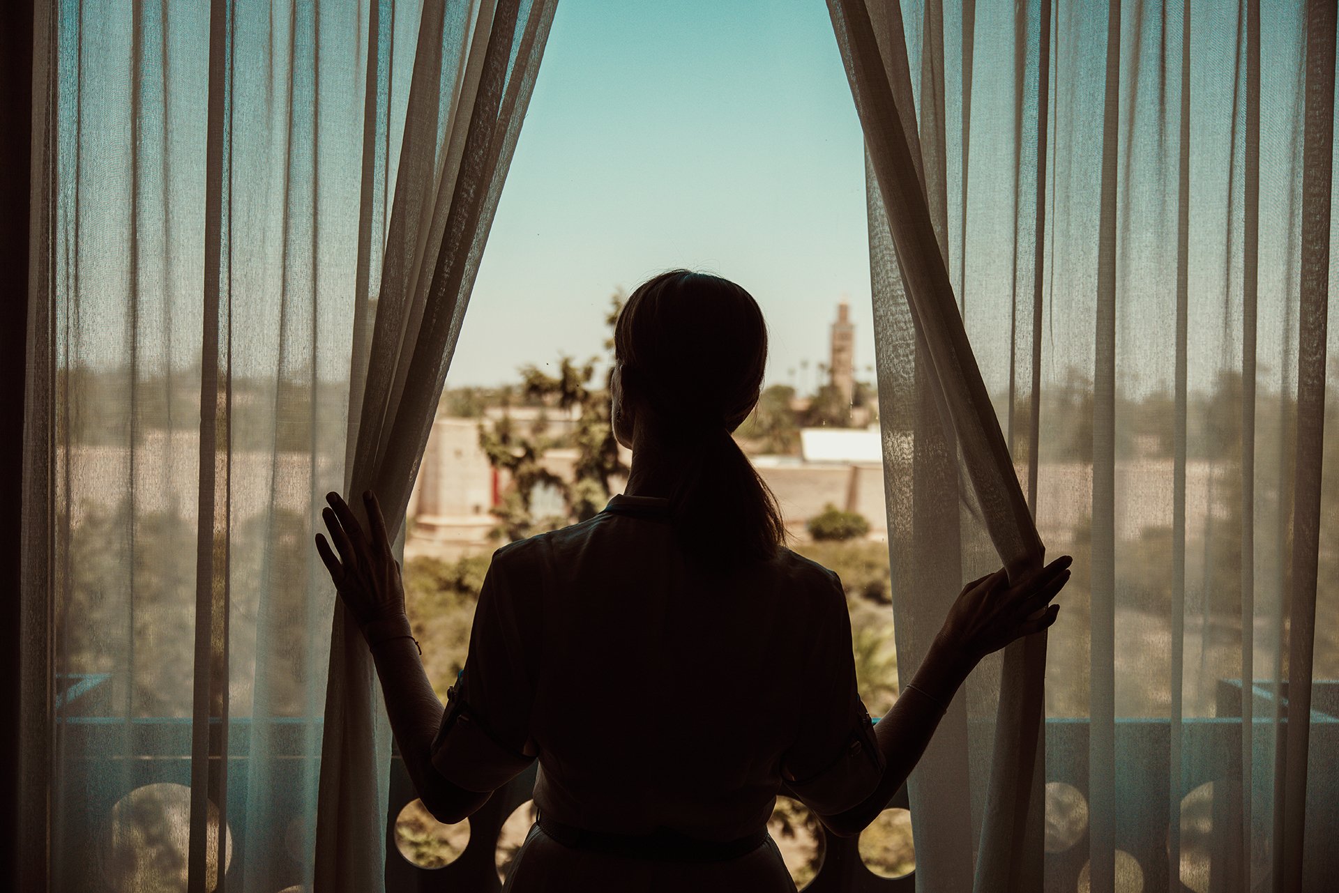 Woman watching the view through window