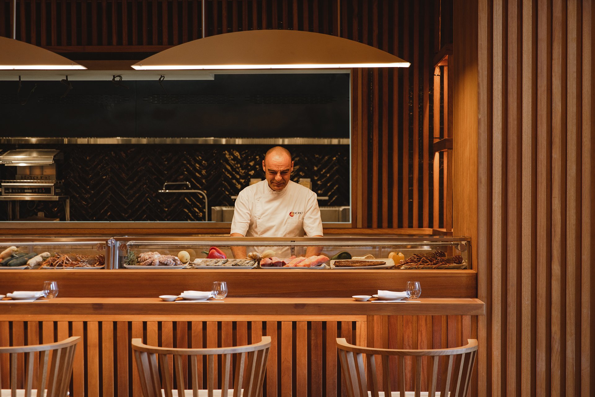 Chefs cooking at the bar table