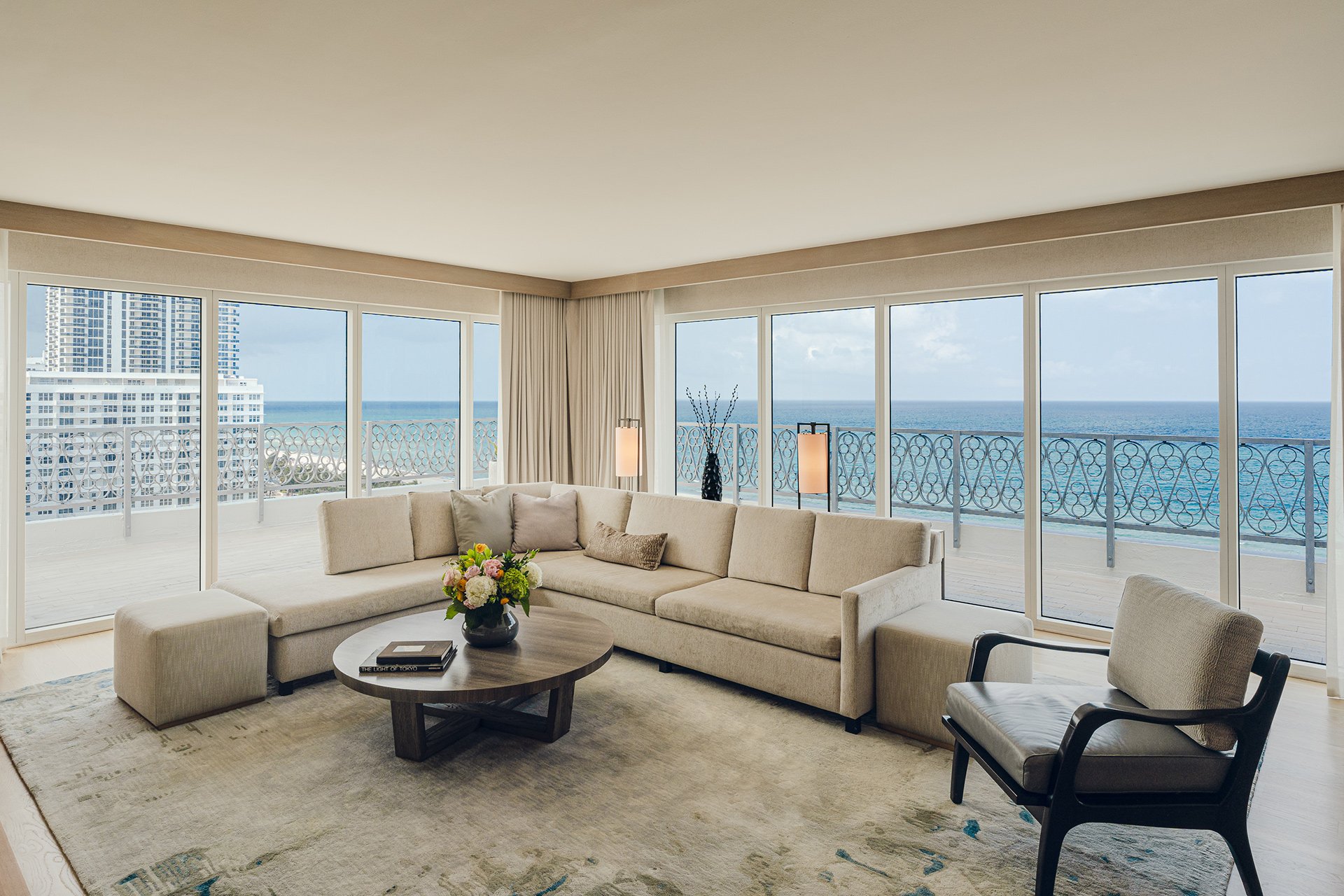 Sand toned couch and balcony view