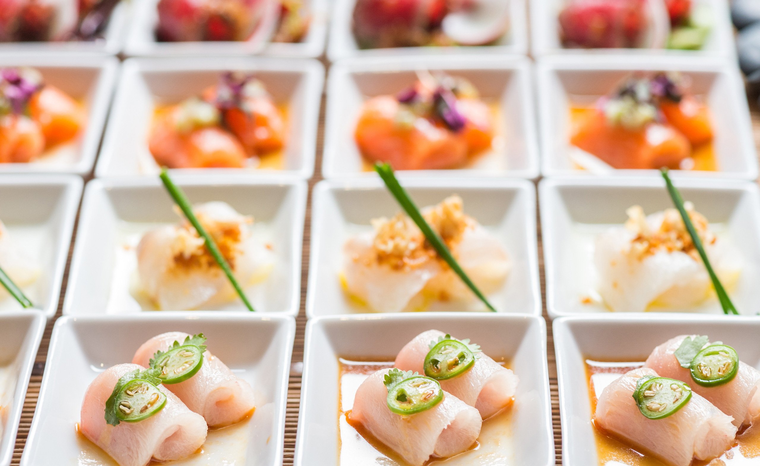 A colourful Japanese cuisines in white dishes for a group party