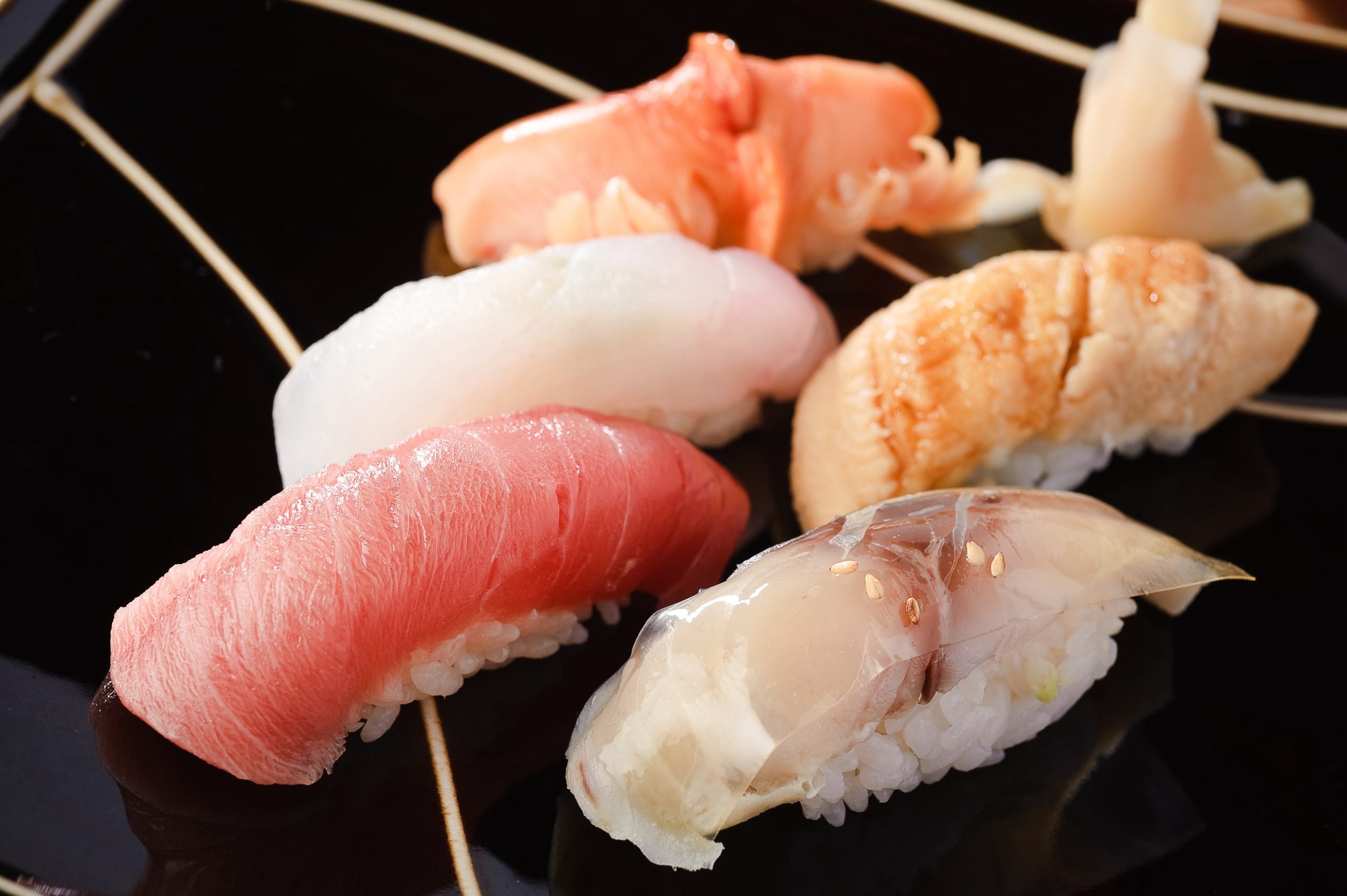 A tempting plate of sushi with an array of fish varieties, perfect for sushi lovers looking to indulge