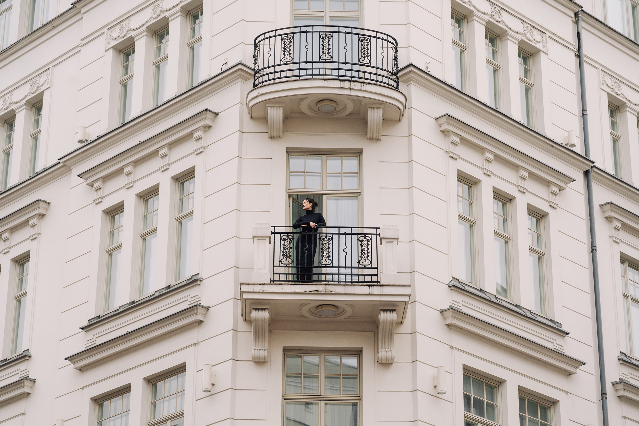 A person enjoying the view from a balcony